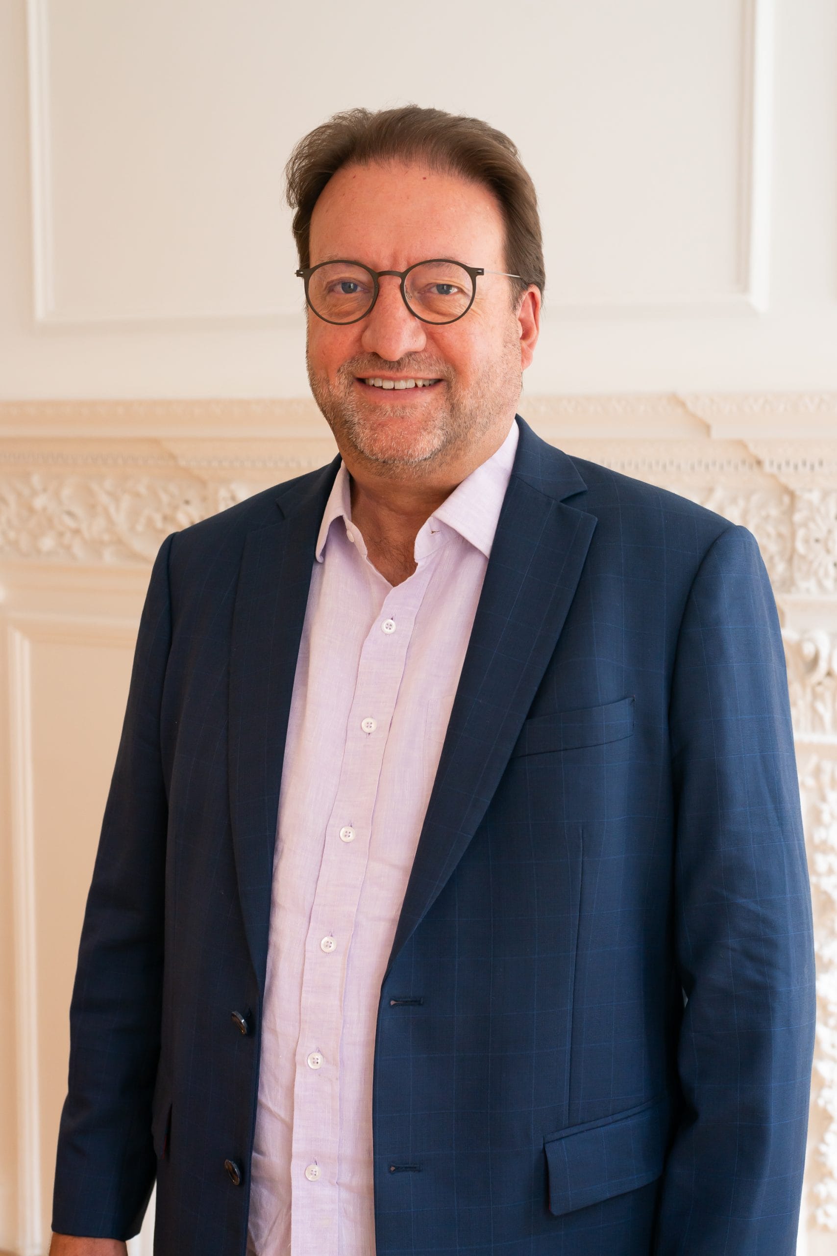 Image: Paul Owens, Co-founder of BOP Consulting, standing in the BOP offices